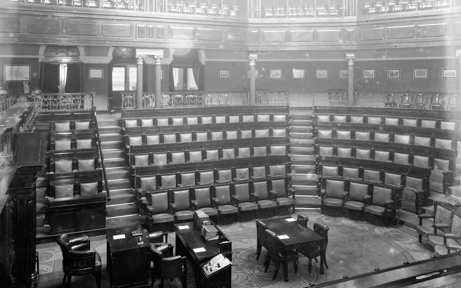An empty chamber shot from the gallery, seating laid out